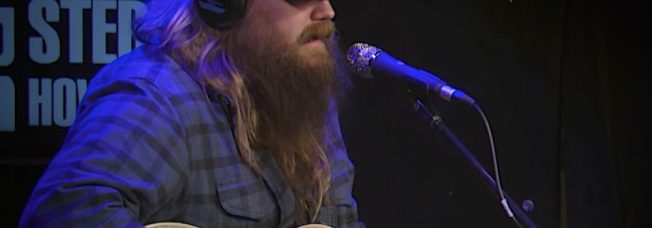 Hijinks Ensue as Chris Stapleton Performs “Broken Halo” & Talks New Album With Howard Stern [Watch]